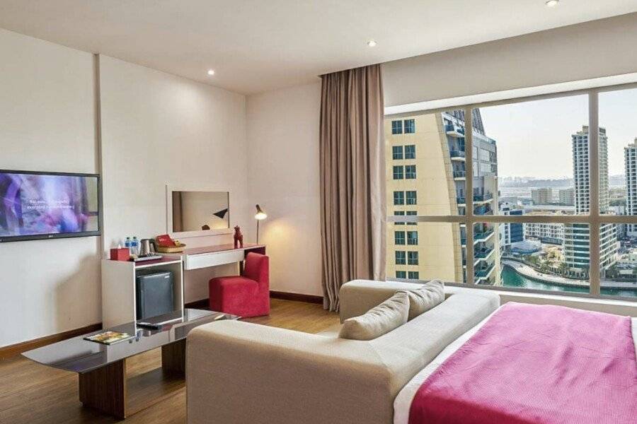 Ramada Hotel, Suites and Apartments by Wyndham JBR hotel bedroom