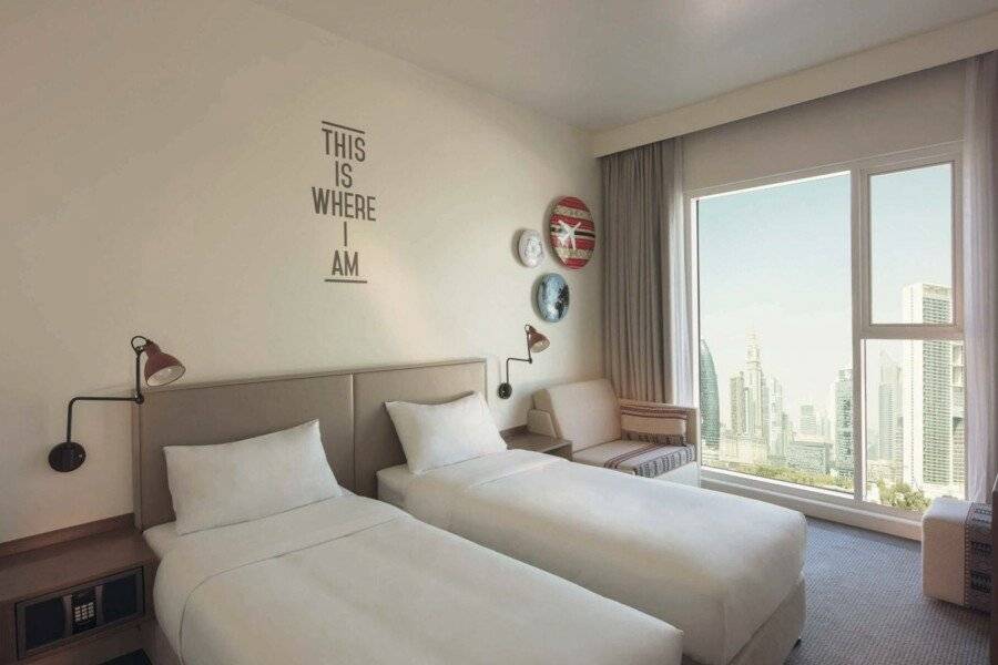 Rove Downtown hotel bedroom,city view