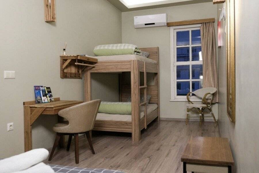 Second Home Suites hotel bedroom