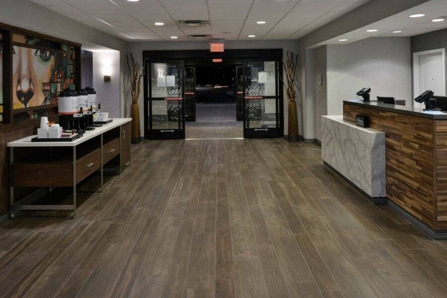 Hampton Inn & Suites Airport lobby, front desk, 