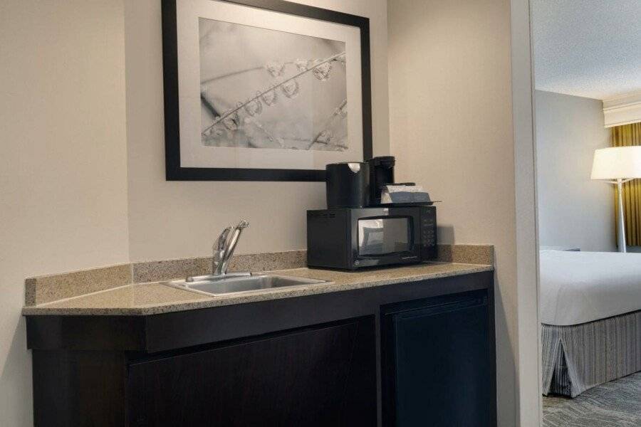 SpringHill Suites by Marriott International Airport kitchen, hotel bedroom