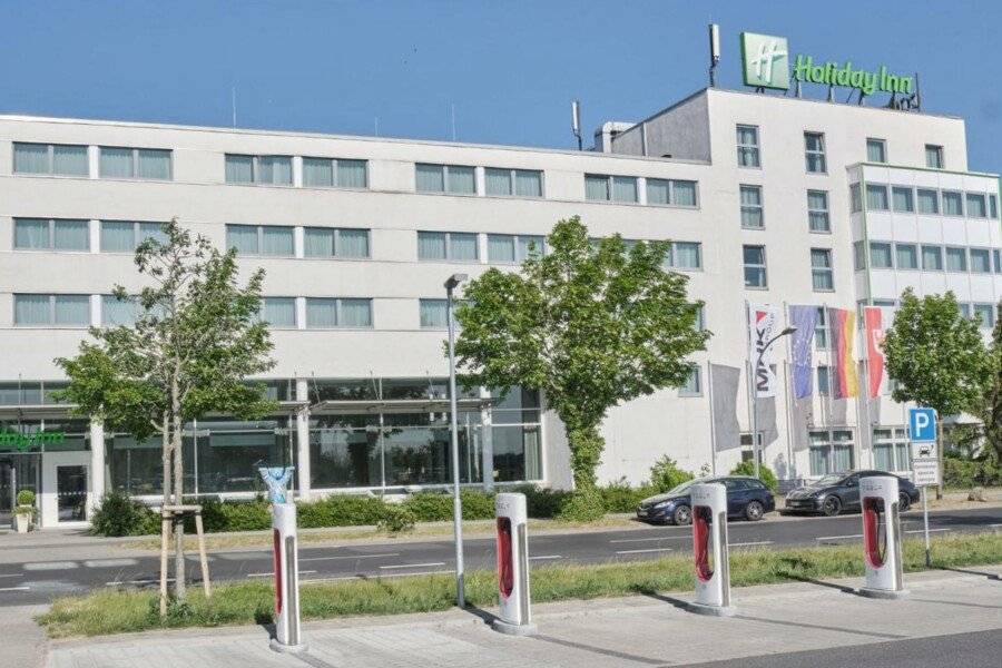 Holiday Inn Berlin Airport facade,parking,electrical vehicle charging station