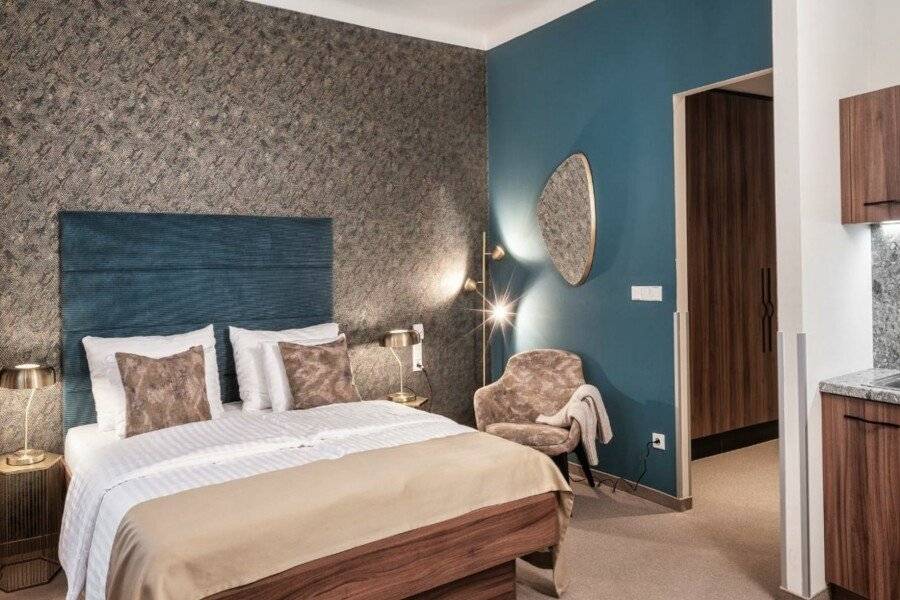 Golden Angel Suites by Adrez hotel bedroom