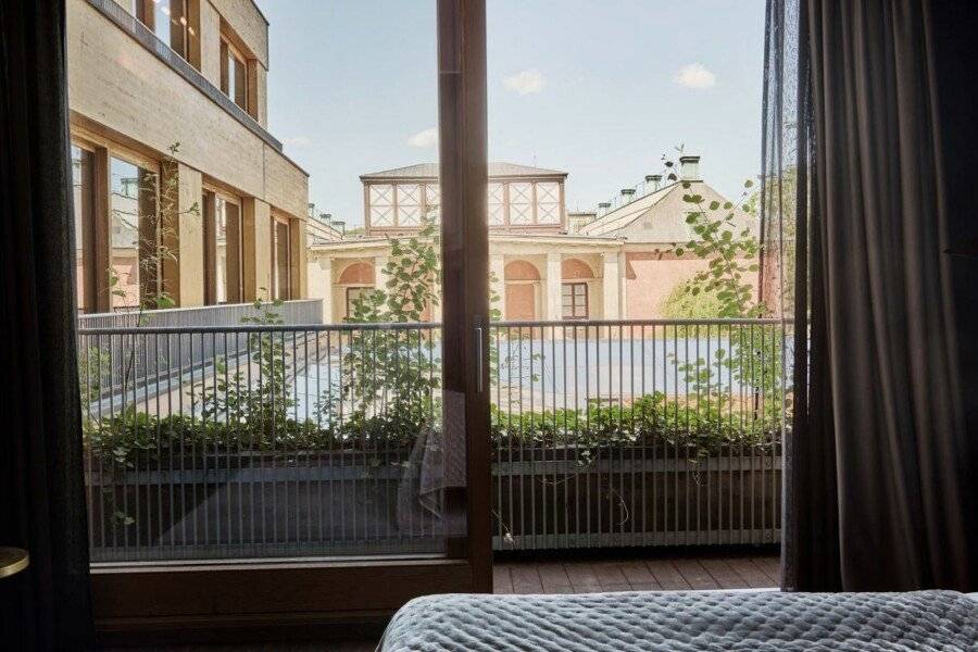 Backstage Hotel hotel bedroom,balcony,outdoor pool