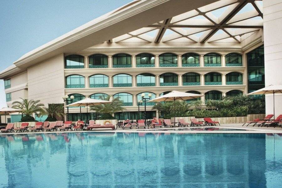 Mövenpick Grand Al Bustan facade,outdoor pool