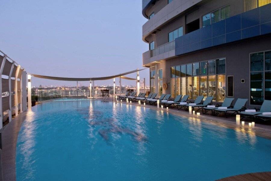 DAMAC Maison Mall Street infinity pool, outdoor pool, hotel facade