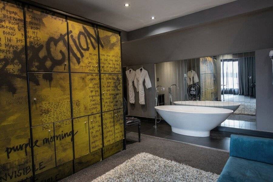 The Exhibitionist Hotel bathtub,hotel bedroom