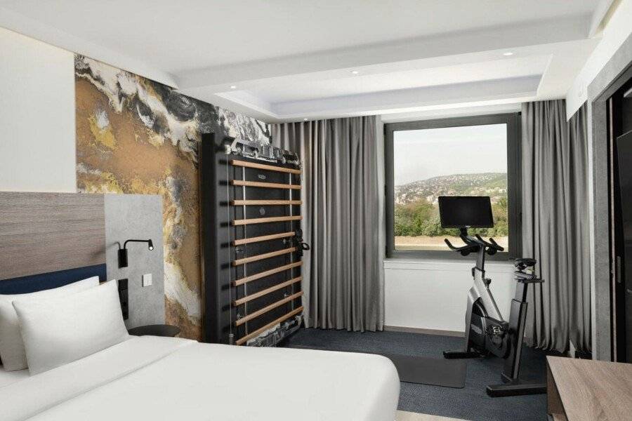 Danubius Hotel Helia hotel bedroom,fitness centre,mountain view