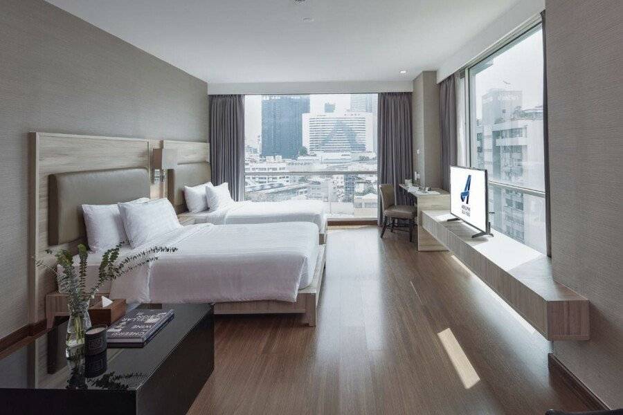 Adelphi Suites Bangkok - SHA Extra Plus hotel bedroom