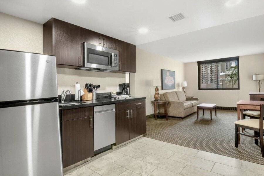 The Carriage House kitchen, hotel bedroom