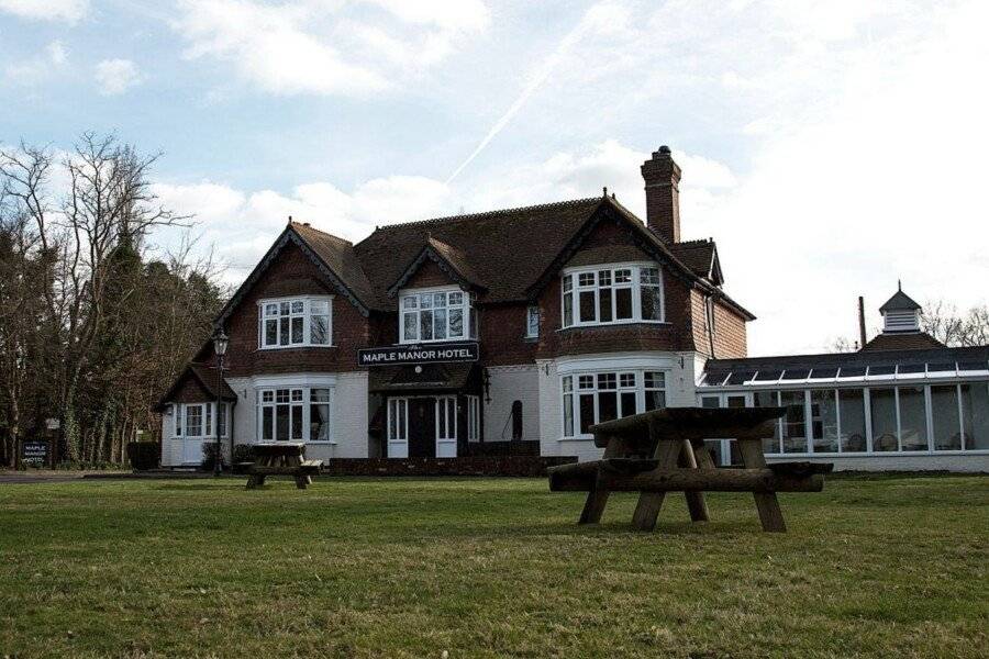 The Maple Manor Hotel facade, garden