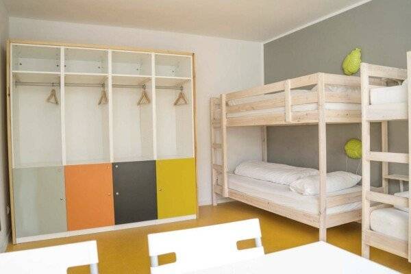 Bed in 4-Bed Dormitory Room with Shared Bathroom